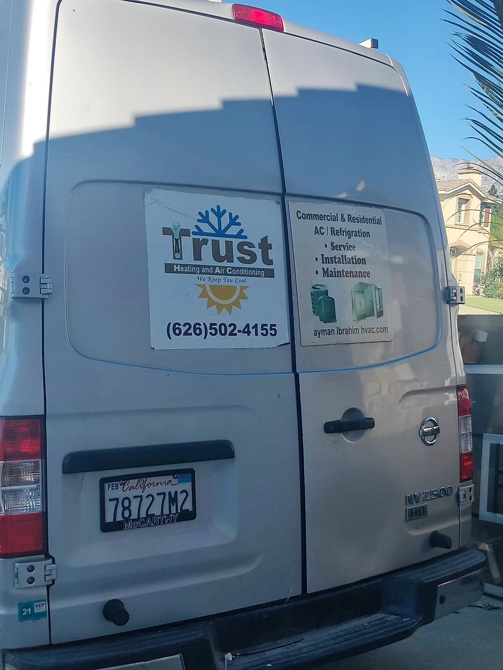 Trust Heating and Air Conditioning service van parked at a job site